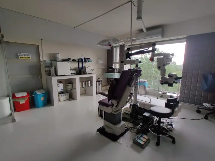Operation theatre with the surgical chair and operating microscope.